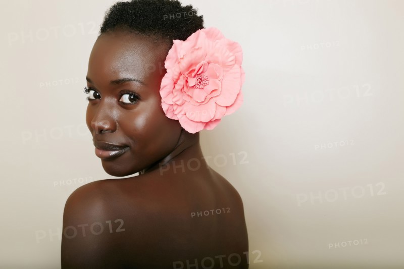 African American woman wearing flower in hair