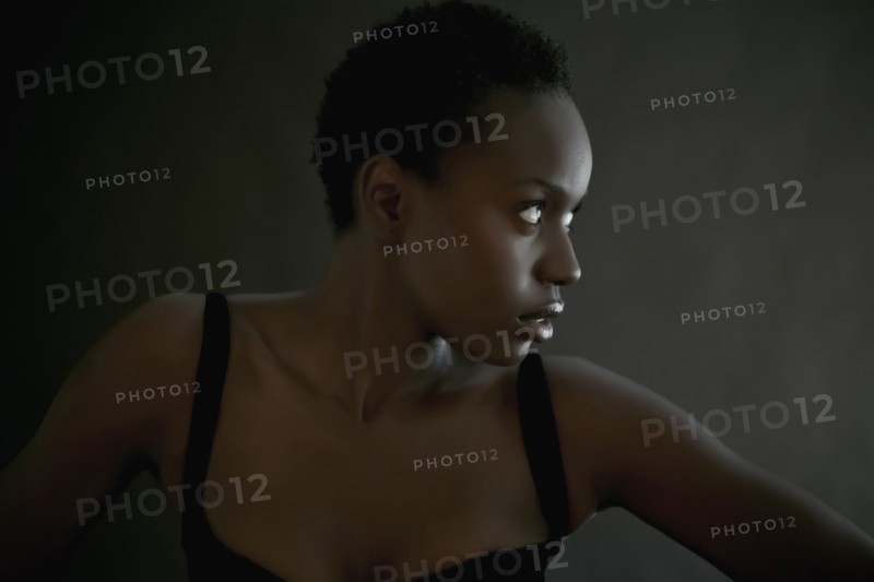 African American woman posing indoors