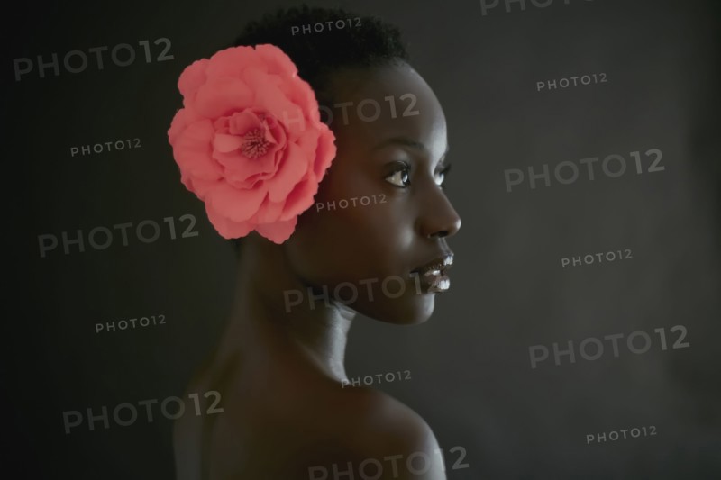 African American woman wearing flower in hair