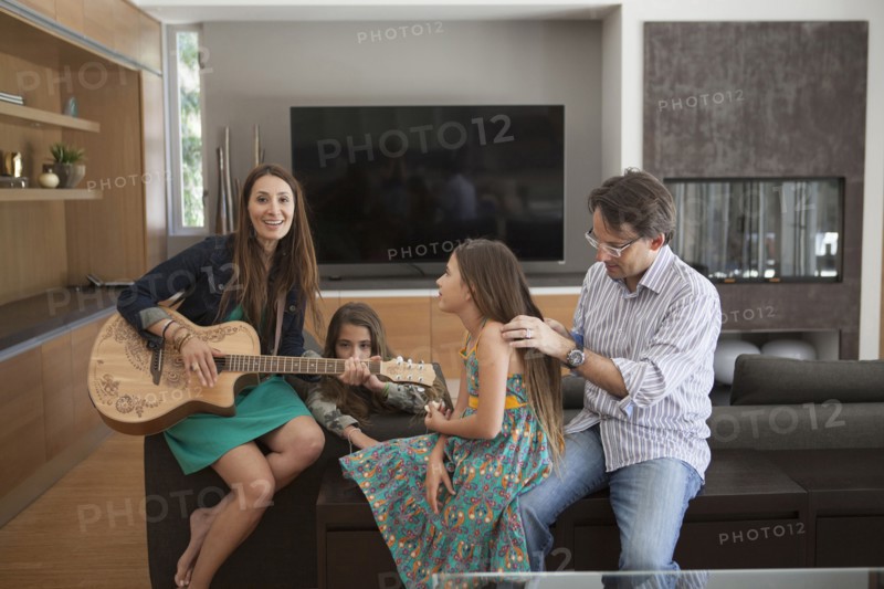 Family relaxing together in living room