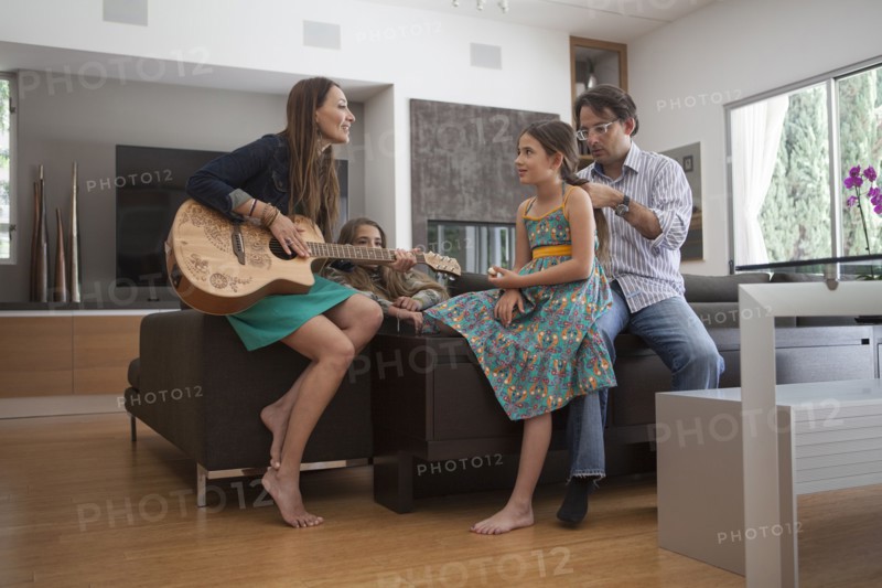 Family relaxing together in living room