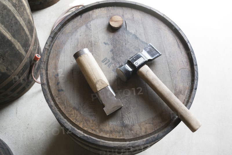 Hammer and chisel on whiskey cask