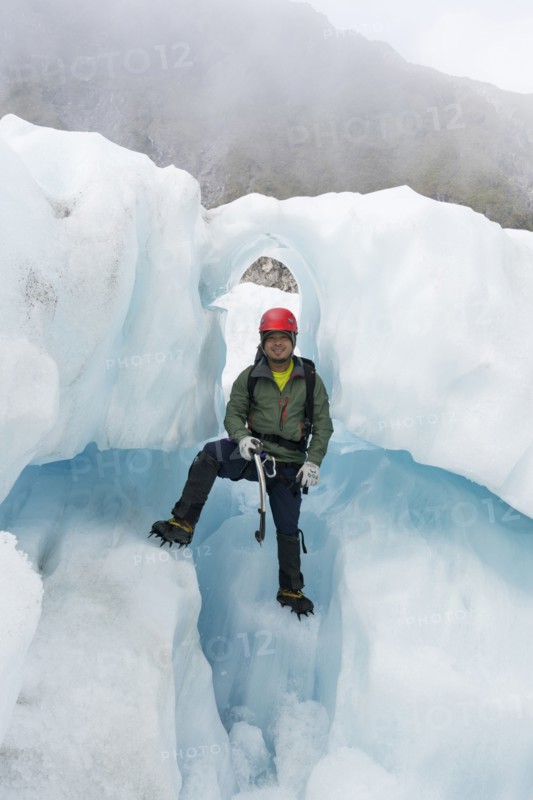Portrait of Chinese man standing on glacier