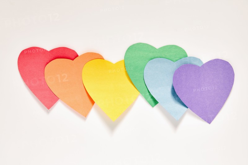 Studio shot of row of rainbow color Paper hearts
