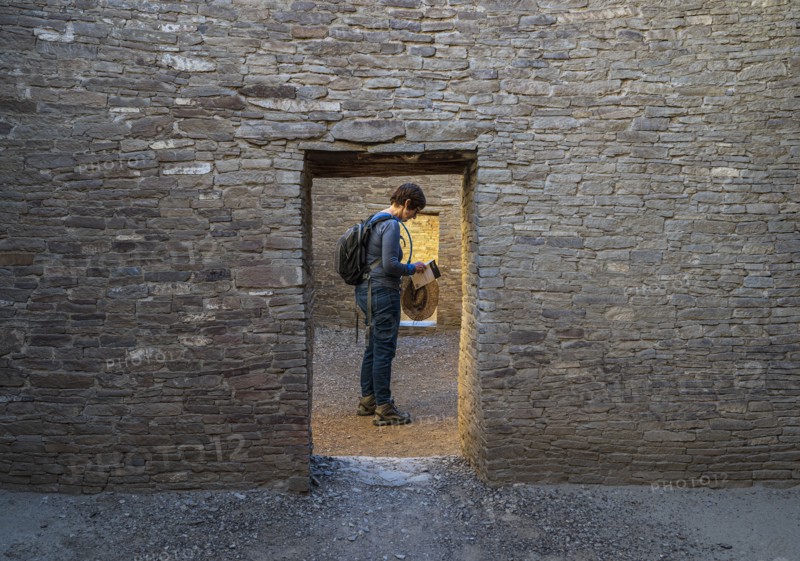 Female tourist reading guidebook