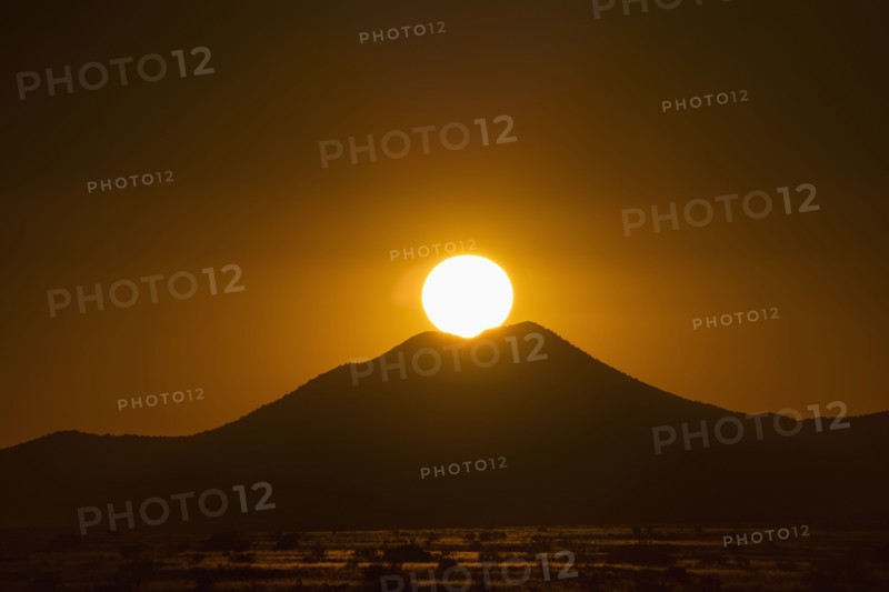 Sun setting above hill in Cerrillos Hills State Park