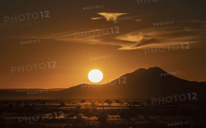 Sun setting above hill in Cerrillos Hills State Park