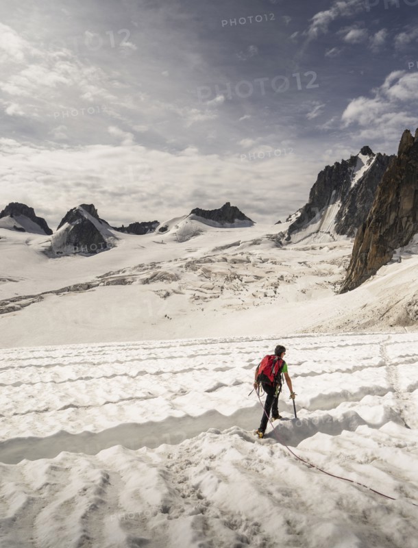 Rear view of climber on glacier