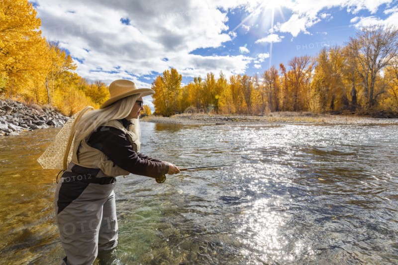 Senior woman fly-fishing