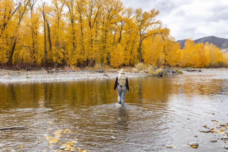 Senior woman fly-fishing