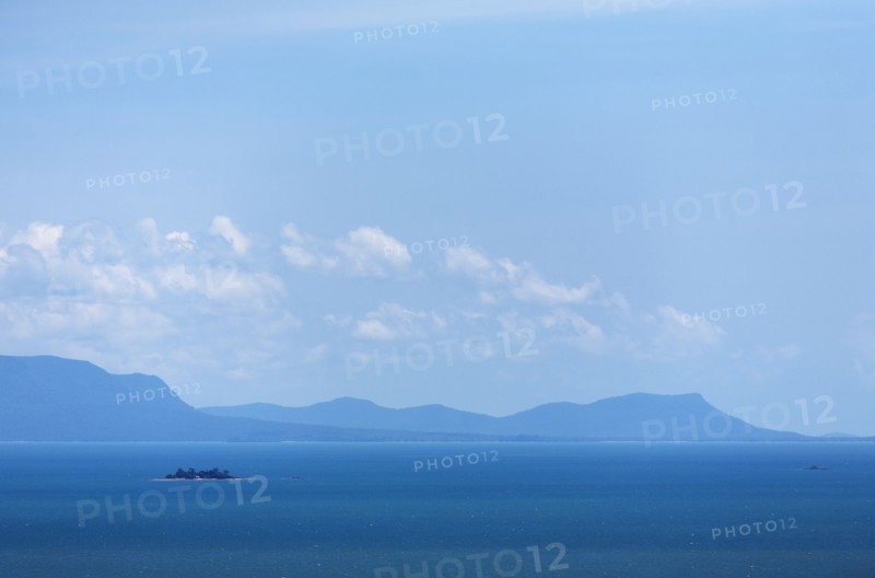Blue sky over sea and mountains