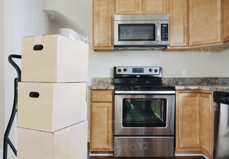 Moving boxes in kitchen