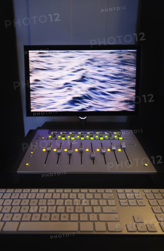 Mixing console and computer in recording studio