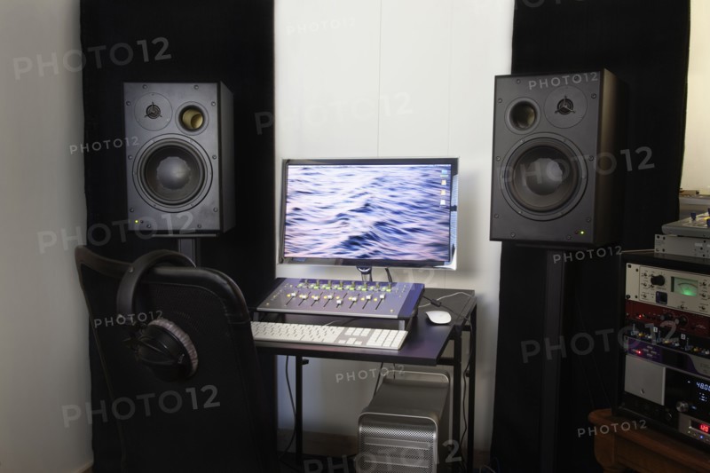 Mixing console and speakers in recording studio