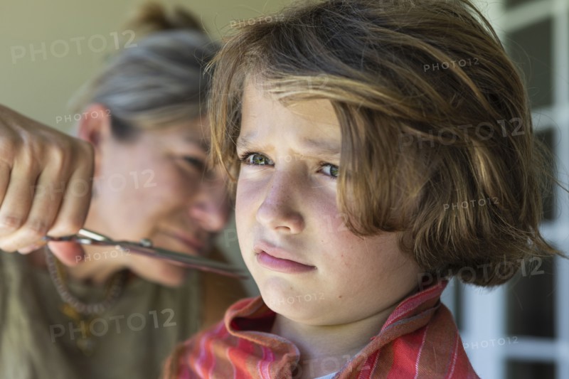 Boy getting haircut