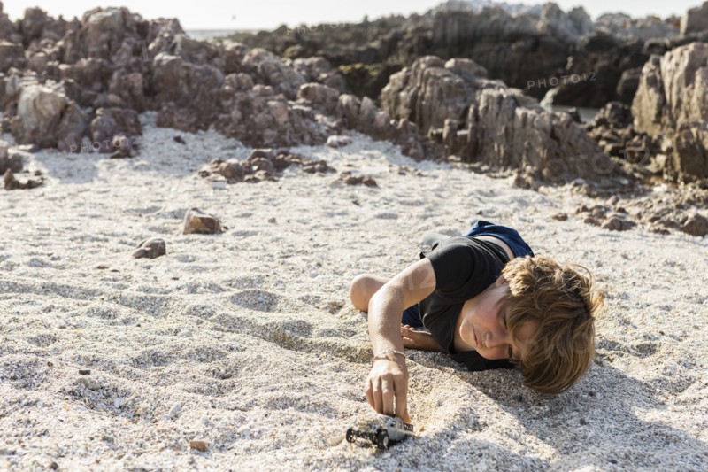Boy playing on beach