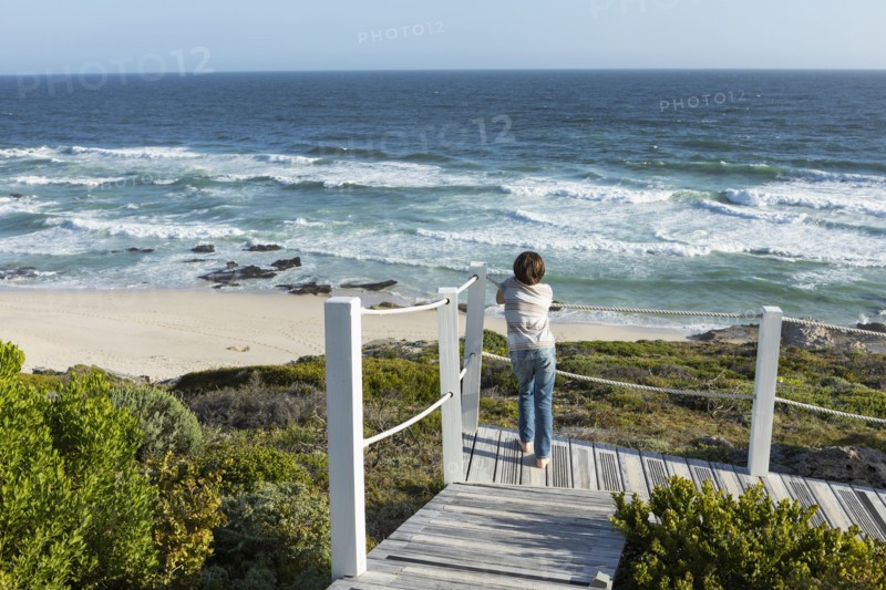 Boy looking at ocean view