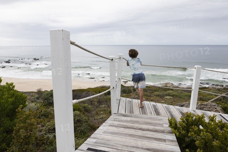 Boy looking at ocean view