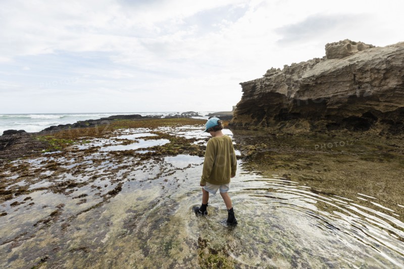 Boy exploring tidal pools