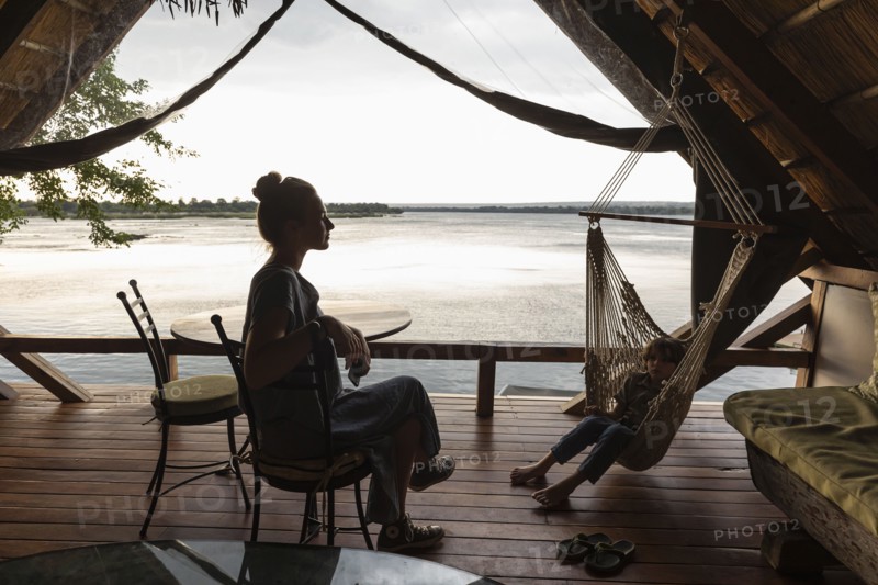 Brother and sister relaxing in lodge