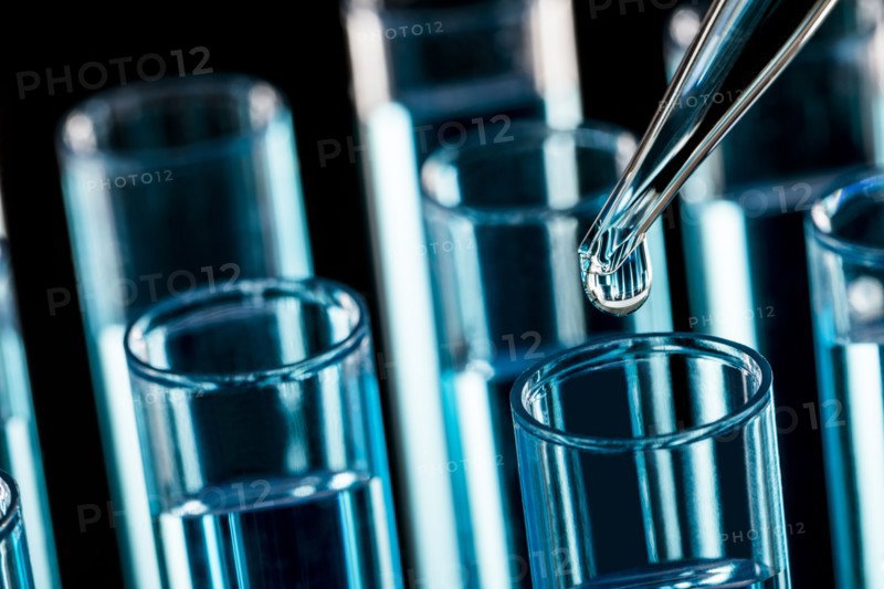 Pipette dropping liquid into test tube