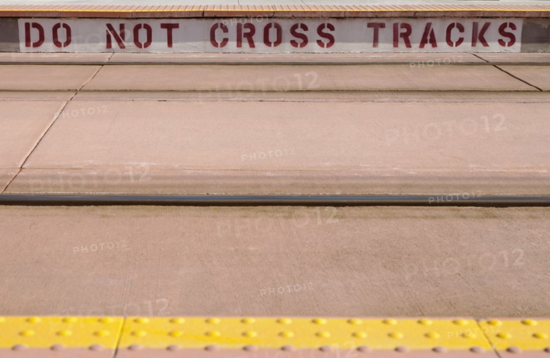 Warning text on platform