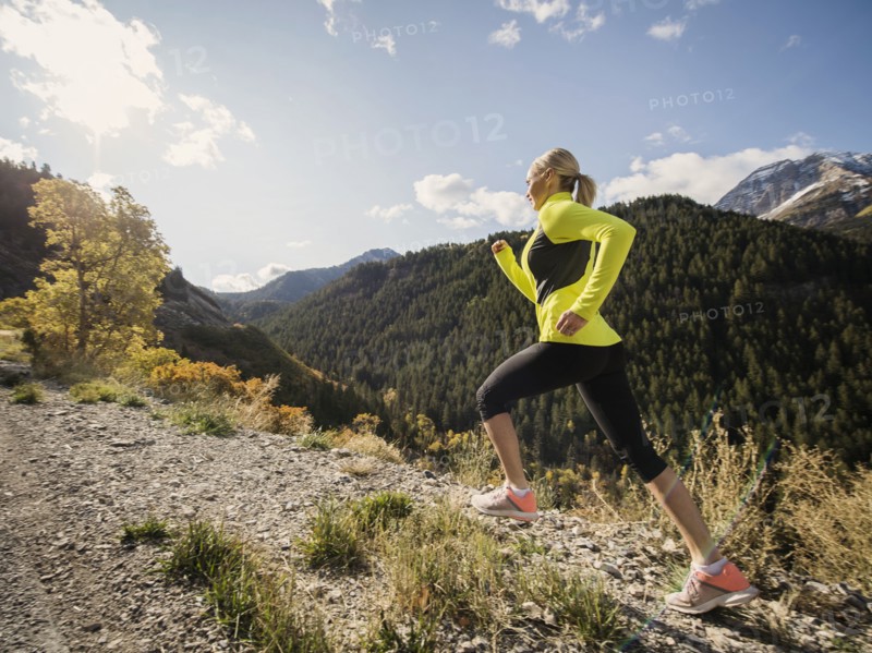 Woman jogging in mountain landscape
