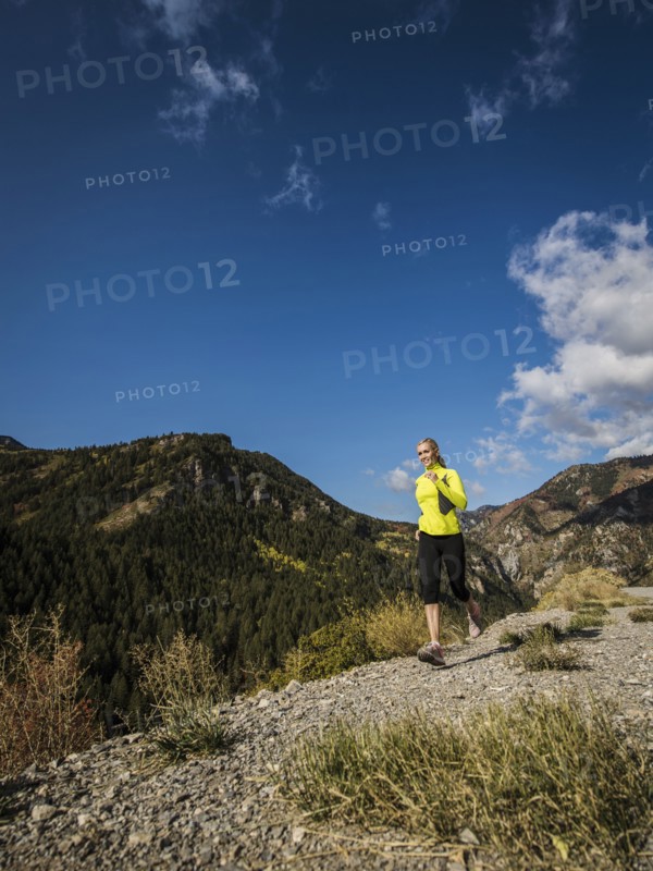 Woman jogging in mountain landscape