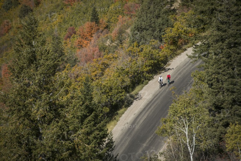 Aerial view of man and woman riding bicycles on country road