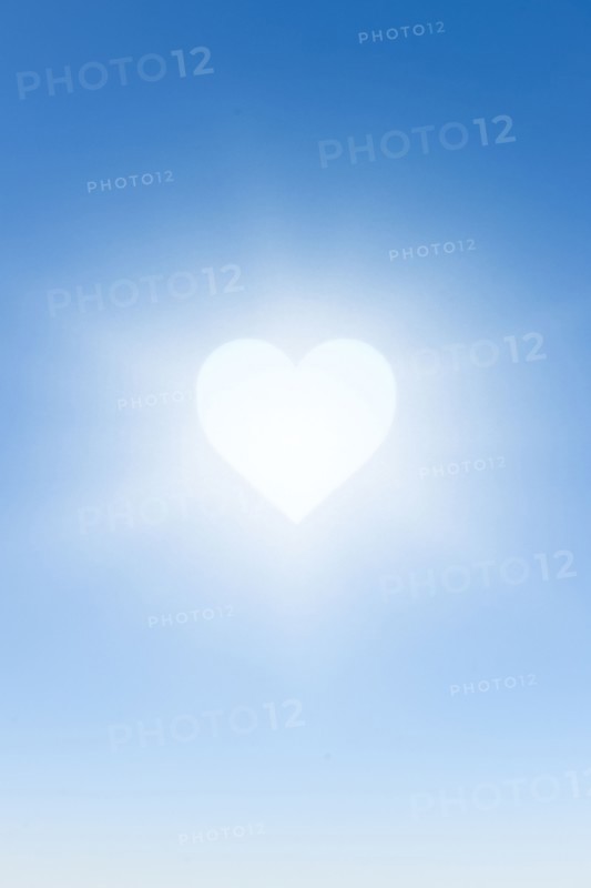 White heart against blue sky