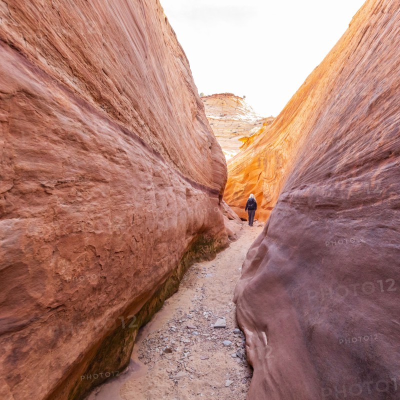 Senior hiker exploring slot canyon