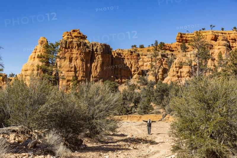 Senior hiker in rocky landscape