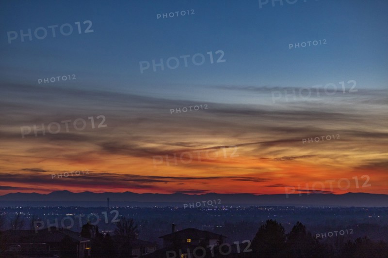Sunset above city and mountains