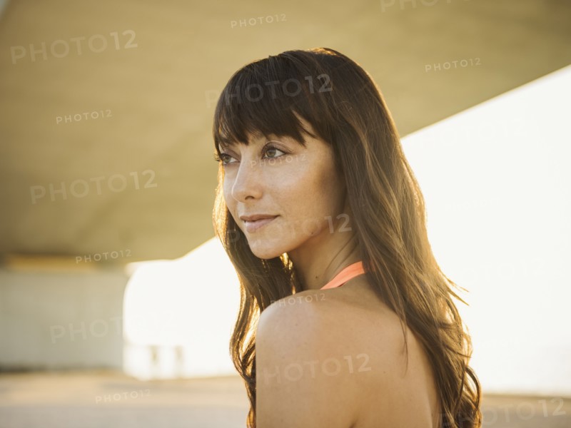 Portrait of pensive woman under bridge