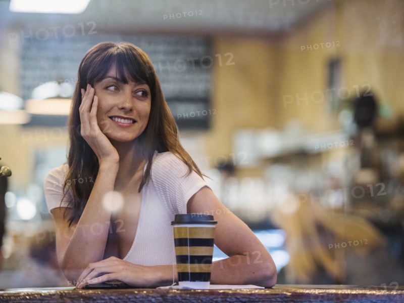 Smiling woman sitting in cafe