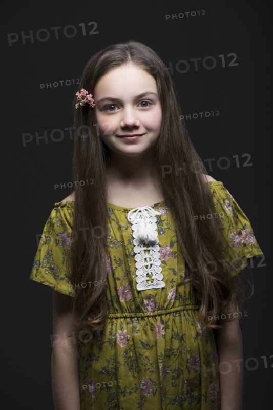 Studio portrait of smiling girl