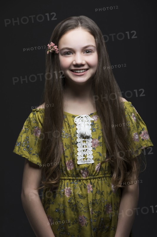 Studio portrait of smiling girl