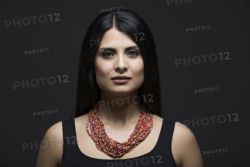 Studio portrait of elegant woman