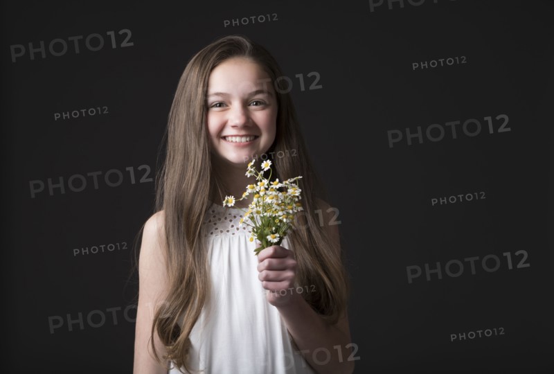 Studio portrait of smiling girl
