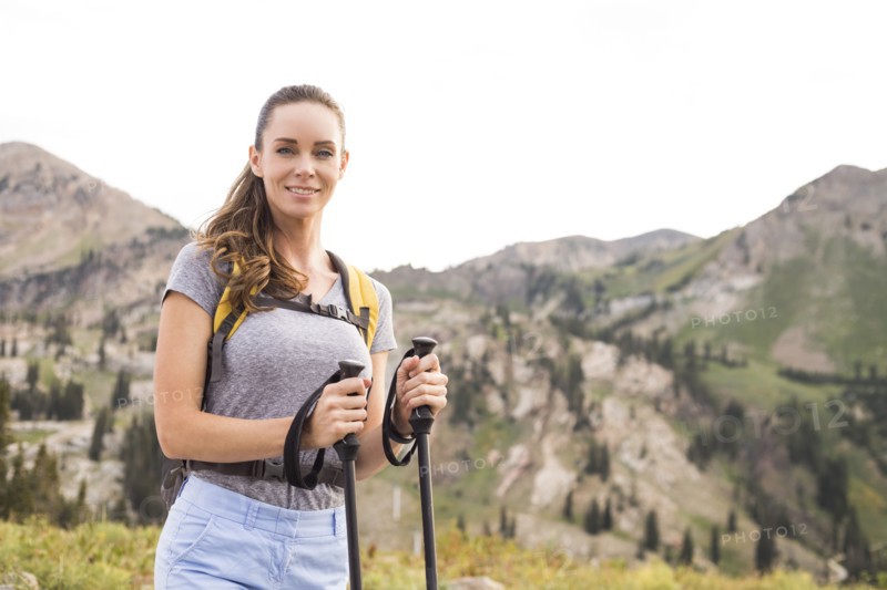Portrait of smiling woman hiking in mountains