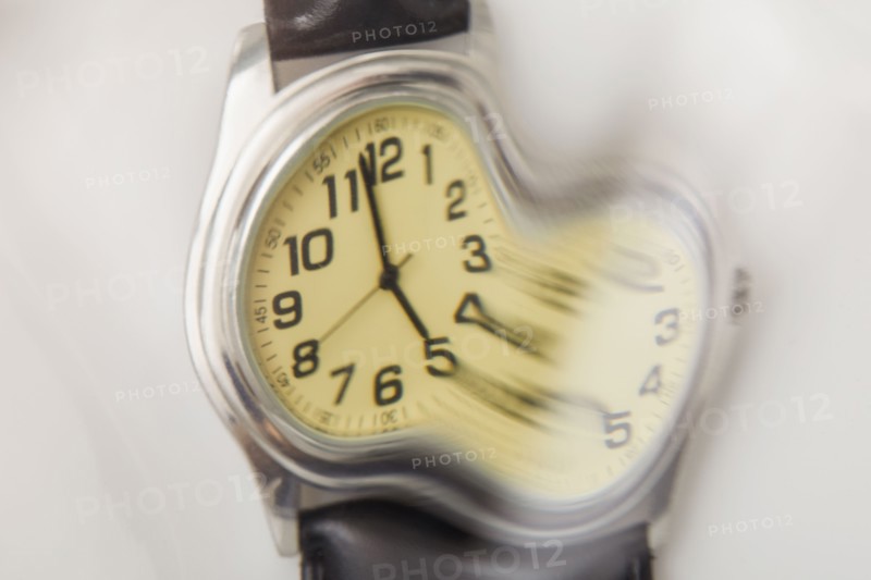 Close-up of distorted wristwatch