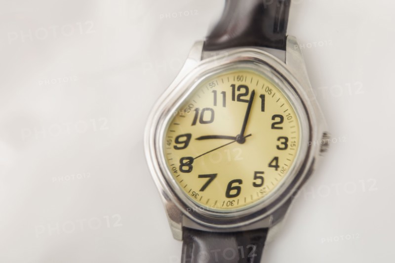 Close-up of distorted wristwatch