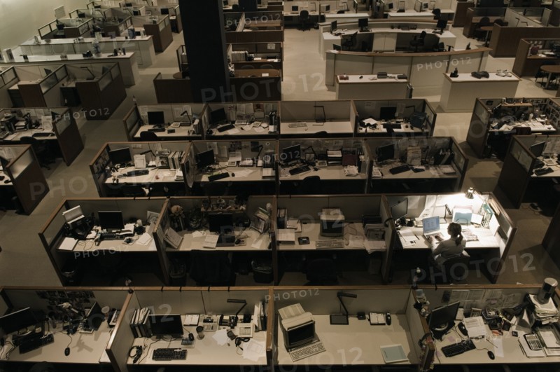 Woman working late at night in office