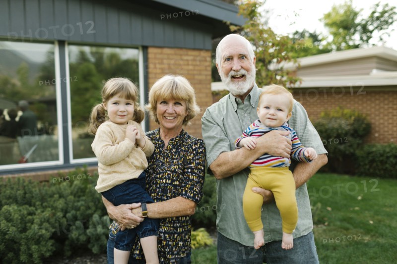Portrait of smiling grandparents with grandchildren