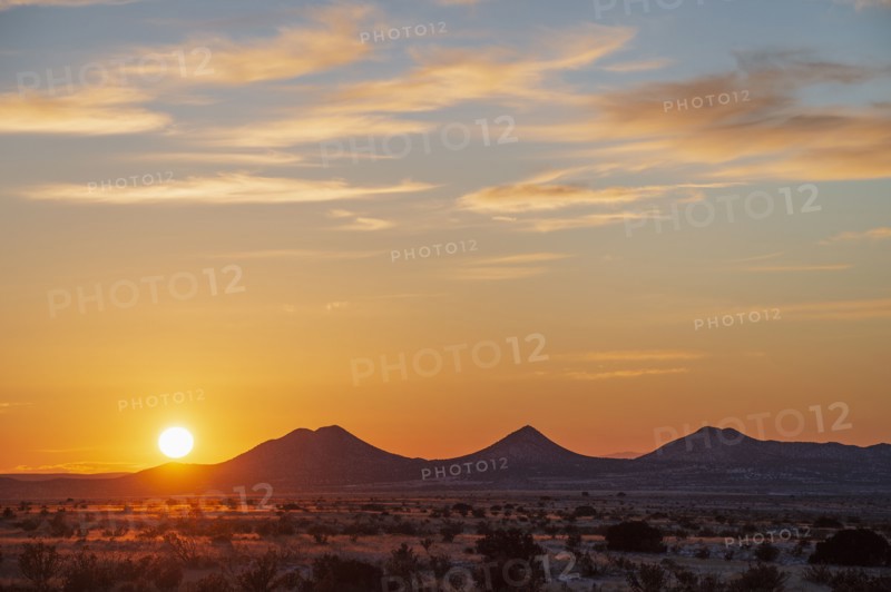 Sun setting over hills in Cerrillos Hills State Park