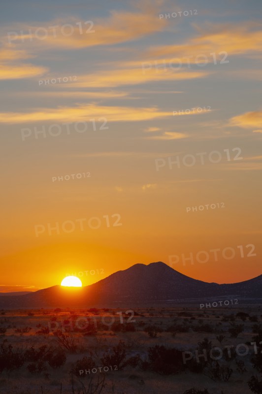 Sun setting over hills in Cerrillos Hills State Park