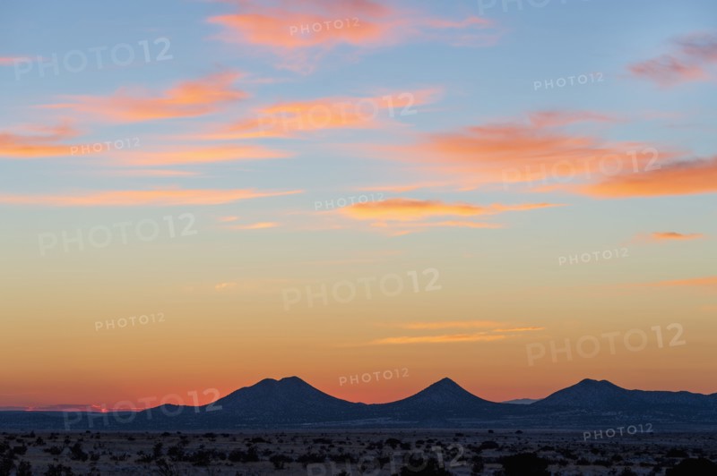 Sun setting over hills in Cerrillos Hills State Park