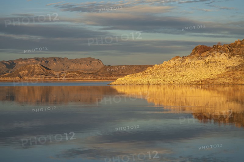 Rock formations reflected in water in Elephant Butte Lake State Park