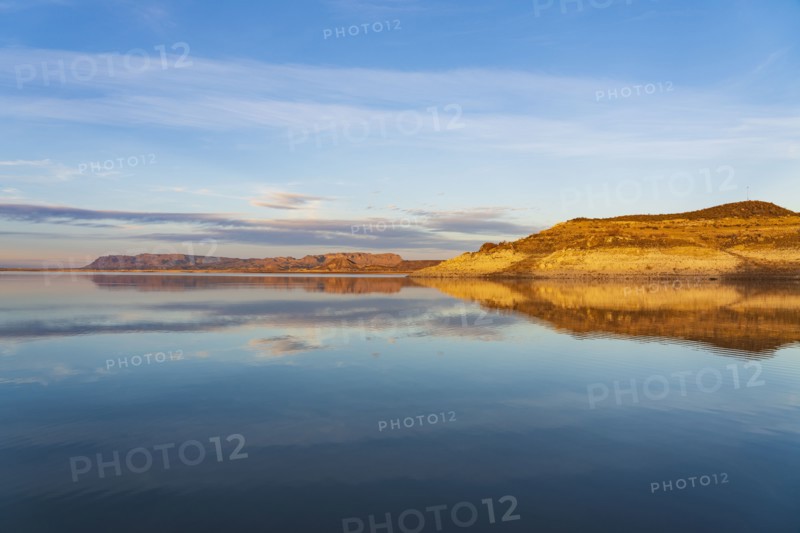 Rock formations reflected in water in Elephant Butte Lake State Park