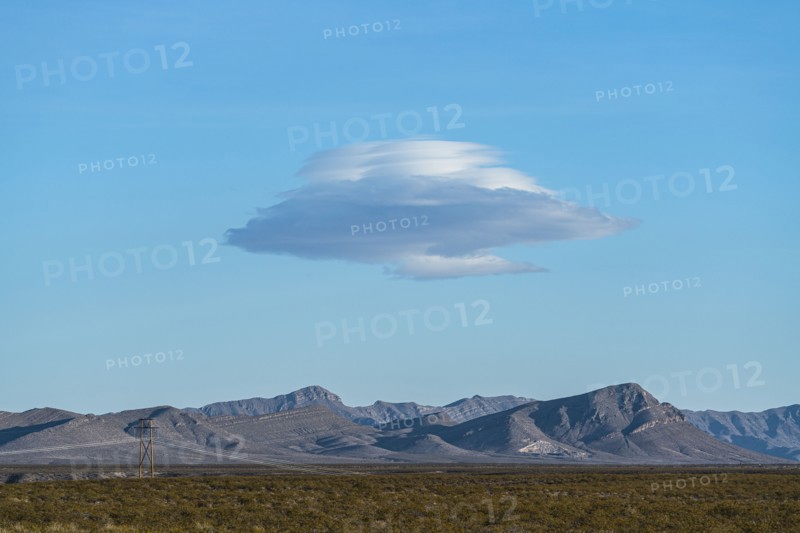 Lenticular cloud over landscape
